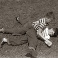 I can remember when I was a kid; a hot summer day with a couple of friends doing the stuff the boys do.  In the backyard on a carpet of...